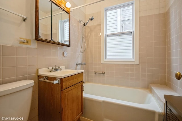 2109 N Long Ave, Chicago, IL 60639 - full bathroom with tile walls, vanity, toilet, and healthy amount of natural light