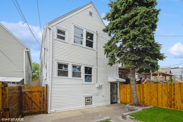 2109 N Long Ave, Chicago, IL 60639 - view of front of property featuring a gate and a patio