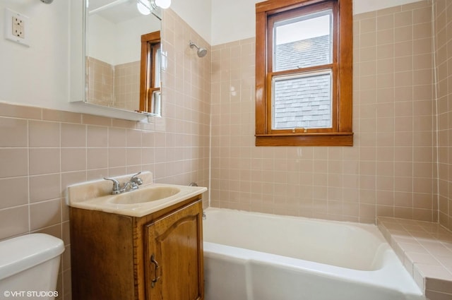 2109 N Long Ave, Chicago, IL 60639 - bathroom with toilet, tile walls, vanity, and shower / bath combination