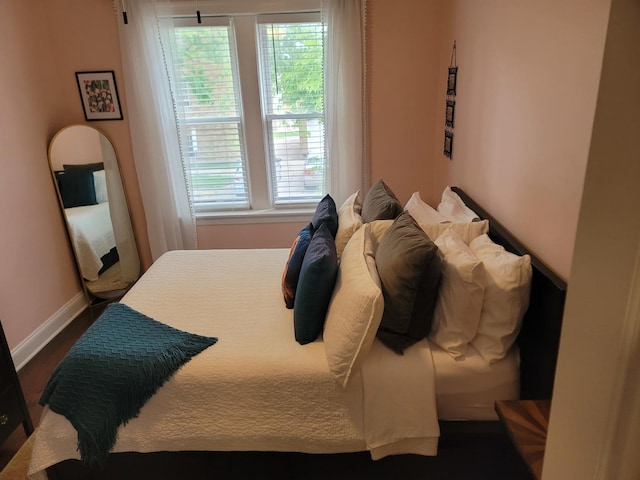 6418 18th St Unit 7, Berwyn, IL 60402 - bedroom with multiple windows, baseboards, and dark wood-style floors
