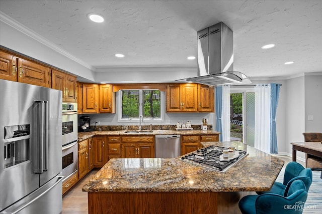 440 Cranesbill Dr, West Chicago, IL 60185 - kitchen with appliances with stainless steel finishes, island exhaust hood, brown cabinets, a sink, and ornamental molding