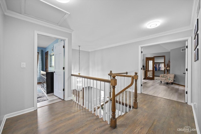 440 Cranesbill Dr, West Chicago, IL 60185 - corridor with an upstairs landing, wood finished floors, baseboards, attic access, and ornamental molding