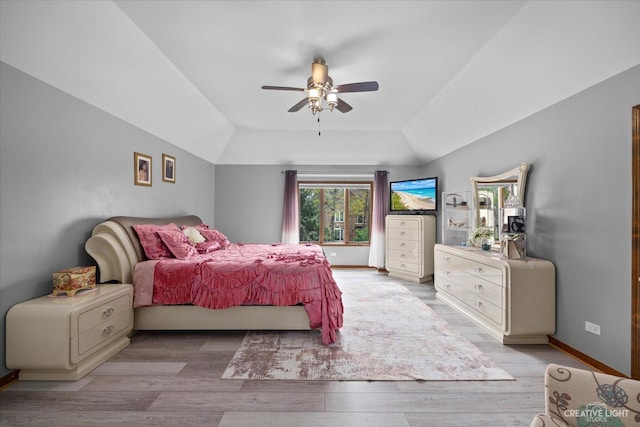 440 Cranesbill Dr, West Chicago, IL 60185 - bedroom with vaulted ceiling, light wood-style floors, ceiling fan, and baseboards