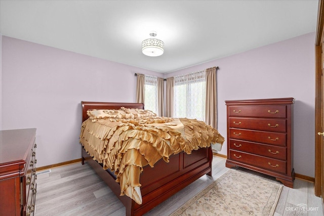 440 Cranesbill Dr, West Chicago, IL 60185 - bedroom with baseboards and light wood-type flooring