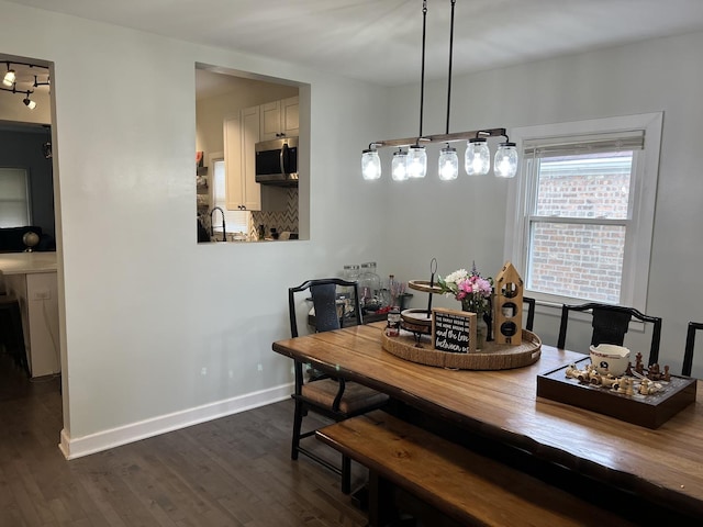 6036 S Loomis Blvd, Chicago, IL 60636 - dining space featuring dark wood finished floors and baseboards