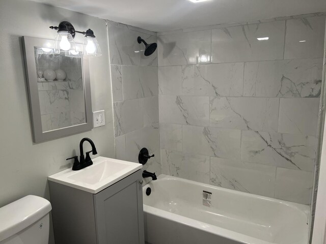 6036 S Loomis Blvd, Chicago, IL 60636 - bathroom featuring vanity, toilet, and washtub / shower combination