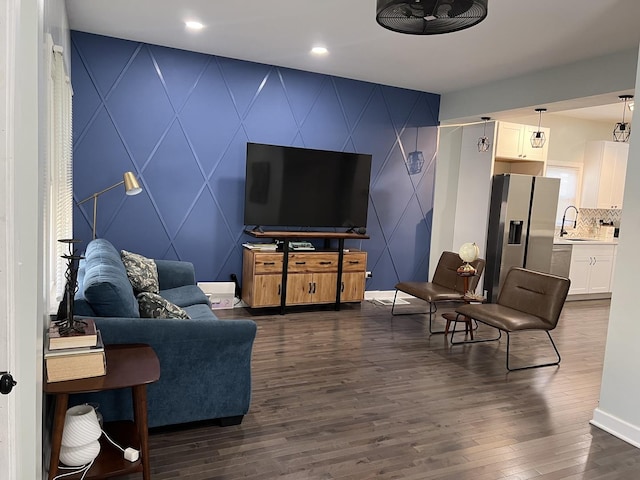 6036 S Loomis Blvd, Chicago, IL 60636 - living room with dark wood-type flooring, baseboards, a decorative wall, and an accent wall