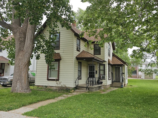 213 5th Ave, Rock Falls, IL 61071 - view of front of home with a shingled roof and a front yard