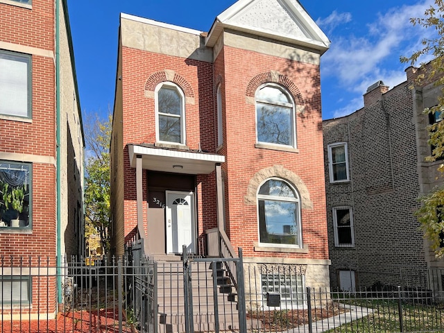 3216 W Walnut St, Chicago, IL 60624 - view of front of home featuring brick siding and a fenced front yard
