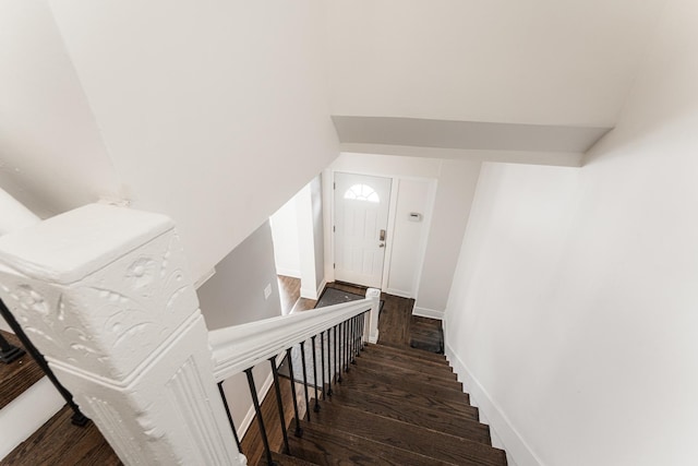3216 W Walnut St, Chicago, IL 60624 - staircase with wood finished floors, lofted ceiling, and baseboards