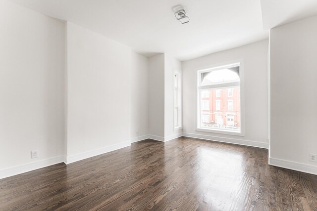 3216 W Walnut St, Chicago, IL 60624 - empty room with dark wood-type flooring and baseboards