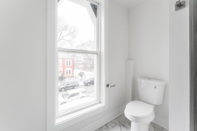 3216 W Walnut St, Chicago, IL 60624 - bathroom featuring toilet, baseboards, and marble finish flooring