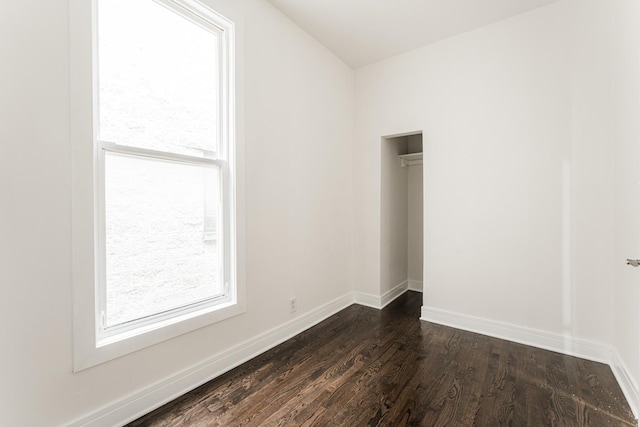 3216 W Walnut St, Chicago, IL 60624 - unfurnished bedroom featuring dark wood-style flooring, baseboards, and a closet