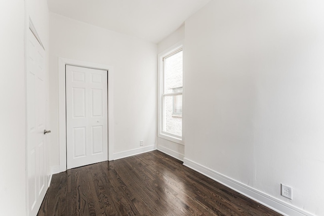 3216 W Walnut St, Chicago, IL 60624 - unfurnished bedroom featuring dark wood-type flooring and baseboards