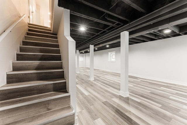 3216 W Walnut St, Chicago, IL 60624 - basement with stairway, wood finished floors, and baseboards