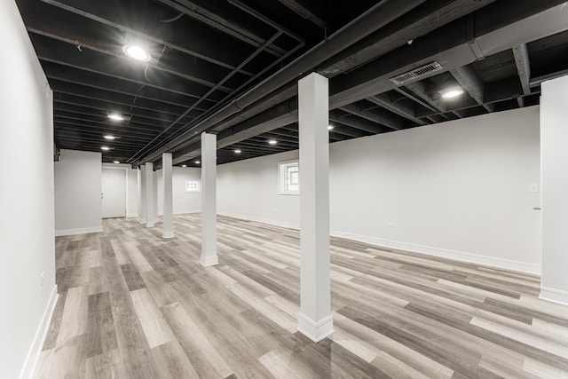 3216 W Walnut St, Chicago, IL 60624 - below grade area featuring wood finished floors and baseboards