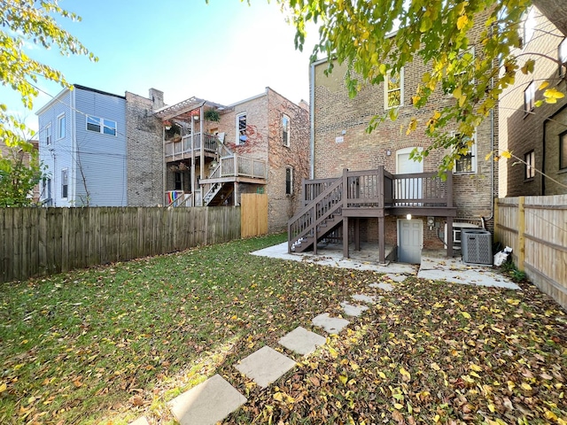 3216 W Walnut St, Chicago, IL 60624 - back of property with stairway, brick siding, a deck, a patio area, and central air condition unit