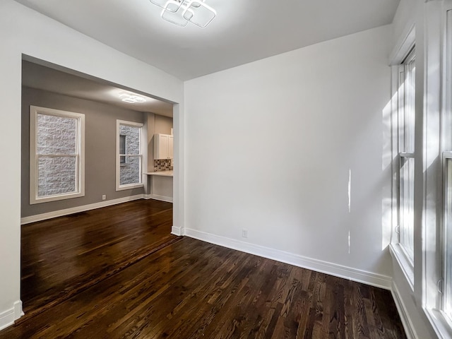 3216 W Walnut St, Chicago, IL 60624 - spare room with dark wood-style flooring and baseboards
