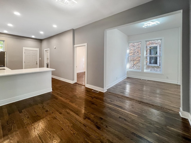 3216 W Walnut St, Chicago, IL 60624 - empty room with dark wood-style floors, baseboards, and recessed lighting