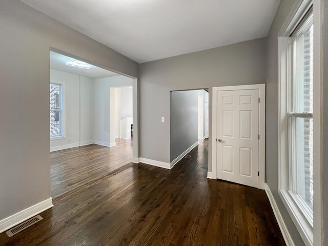3216 W Walnut St, Chicago, IL 60624 - spare room with dark wood-style floors and baseboards