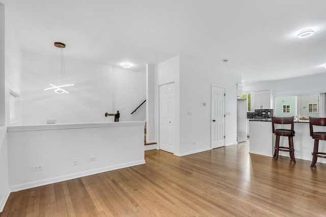 1544 Sauganash Ct, Gurnee, IL 60031 - unfurnished living room featuring wood finished floors and baseboards