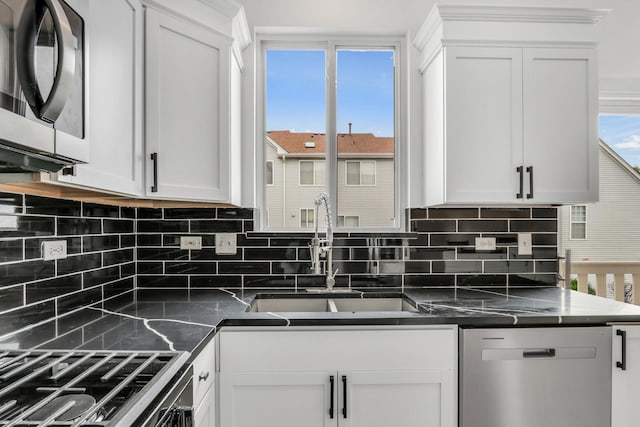 1544 Sauganash Ct, Gurnee, IL 60031 - kitchen featuring stainless steel appliances, a sink, decorative backsplash, and white cabinets