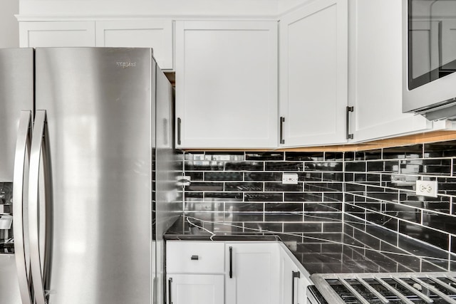 1544 Sauganash Ct, Gurnee, IL 60031 - kitchen with stainless steel appliances, backsplash, white cabinets, and dark stone counters