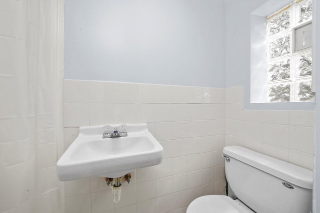 4113 176th Pl, Country Club Hills, IL 60478 - bathroom with tile walls, toilet, a sink, and a wainscoted wall