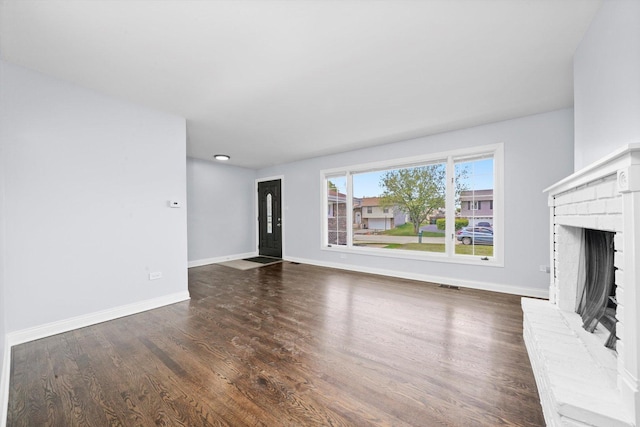 4113 176th Pl, Country Club Hills, IL 60478 - unfurnished living room with wood finished floors, baseboards, and a fireplace