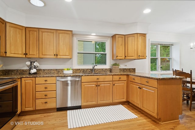 1116 W Mallard Dr, Palatine, IL 60067 - kitchen with appliances with stainless steel finishes, a sink, a peninsula, dark stone counters, and crown molding