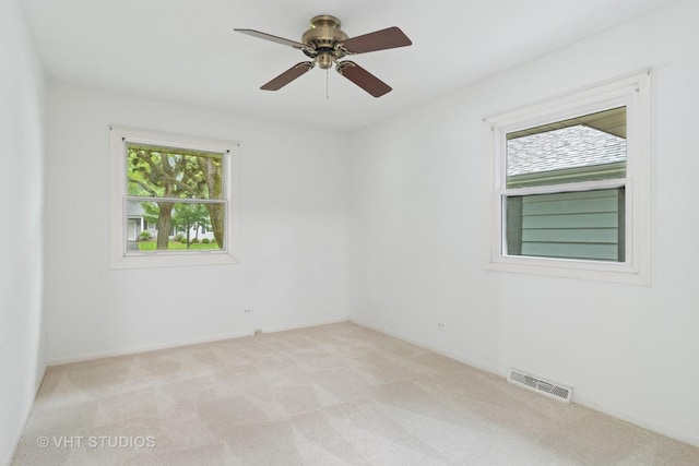 1116 W Mallard Dr, Palatine, IL 60067 - empty room featuring light carpet, a ceiling fan, and baseboards
