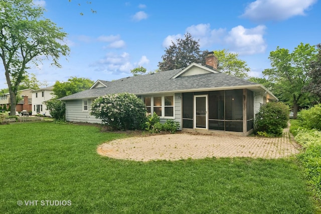1116 W Mallard Dr, Palatine, IL 60067 - back of property with a sunroom, a shingled roof, a chimney, and a yard