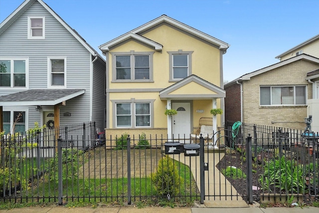 3713 W Palmer St Unit 2, Chicago, IL 60647 - view of front of home with a fenced front yard, brick siding, and stucco siding