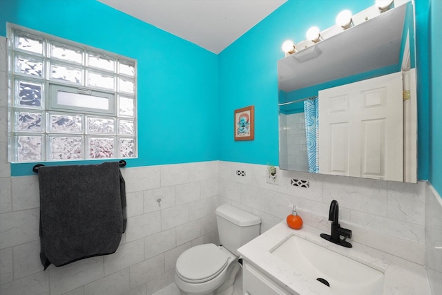 3713 W Palmer St Unit 2, Chicago, IL 60647 - full bath featuring toilet, tile walls, vanity, and a shower with shower curtain