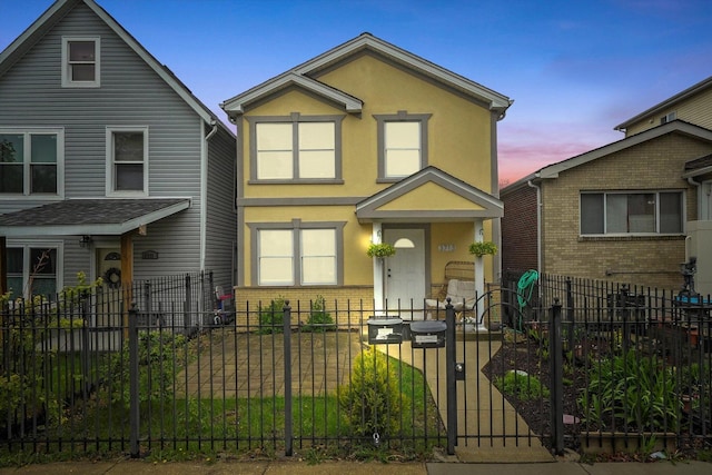 3713 W Palmer St Unit 2, Chicago, IL 60647 - view of front of house featuring brick siding, stucco siding, and a fenced front yard