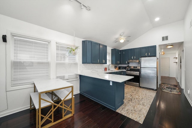 3713 W Palmer St Unit 2, Chicago, IL 60647 - kitchen featuring appliances with stainless steel finishes, a peninsula, lofted ceiling, blue cabinets, and a ceiling fan