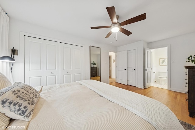 5104 Johnson Ave, Western Springs, IL 60558 - bedroom with light wood-style flooring, baseboards, two closets, ensuite bath, and a ceiling fan