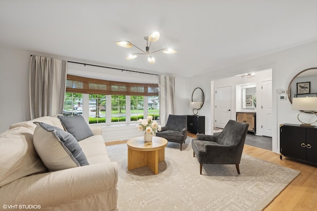 5104 Johnson Ave, Western Springs, IL 60558 - living area with light wood-type flooring and a chandelier