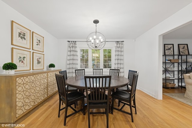 5104 Johnson Ave, Western Springs, IL 60558 - dining room with light wood-type flooring, a chandelier, and baseboards