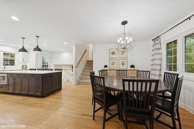 5104 Johnson Ave, Western Springs, IL 60558 - dining space featuring light wood-style floors, a chandelier, recessed lighting, and stairway