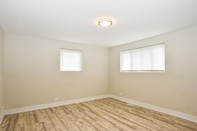 8040 S Lafayette Ave, Chicago, IL 60620 - unfurnished room featuring healthy amount of natural light, light wood-style floors, and baseboards