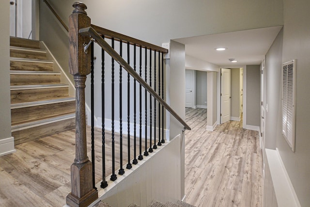 8040 S Lafayette Ave, Chicago, IL 60620 - stairs featuring wood finished floors, baseboards, and a heating unit