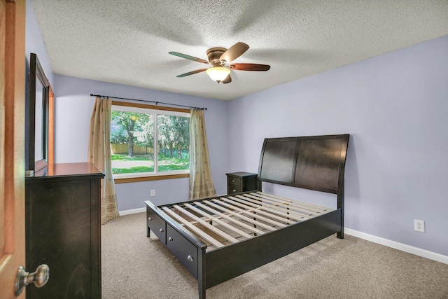 907 S Trailside Dr, Mahomet, IL 61853 - carpeted bedroom featuring a textured ceiling and ceiling fan
