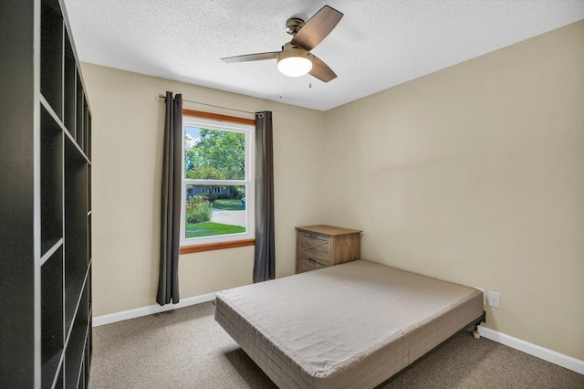 907 S Trailside Dr, Mahomet, IL 61853 - carpeted bedroom with ceiling fan and a textured ceiling