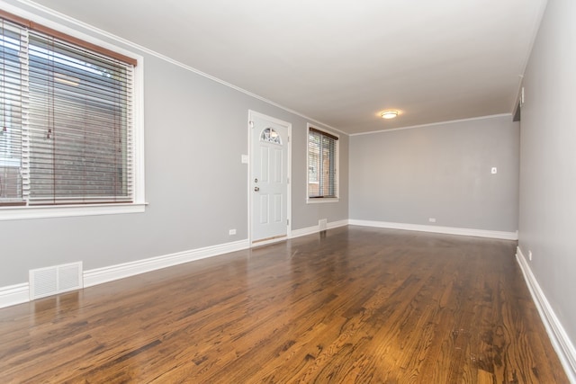 7338 S Campbell Ave, Chicago, IL 60629 - spare room featuring wood finished floors, baseboards, and ornamental molding
