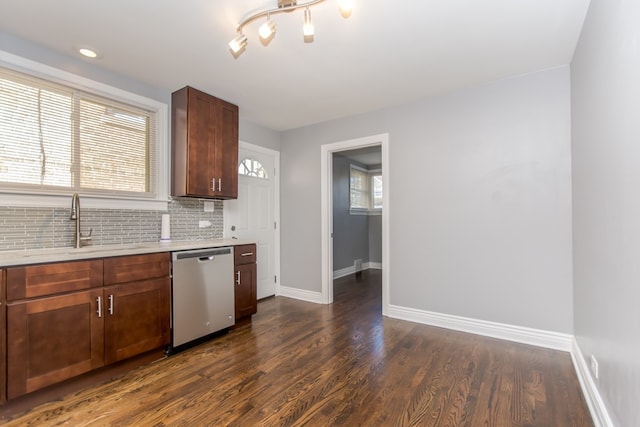 7338 S Campbell Ave, Chicago, IL 60629 - kitchen featuring dishwasher, a sink, light countertops, baseboards, and dark wood-style floors