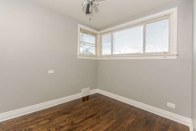 7338 S Campbell Ave, Chicago, IL 60629 - spare room with baseboards, dark wood-type flooring, and ceiling fan