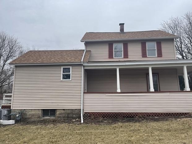 622 Clark St, Marseilles, IL 61341 - view of property exterior featuring a lawn, a porch, and a shingled roof