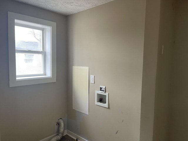 622 Clark St, Marseilles, IL 61341 - laundry room featuring a textured ceiling, baseboards, and washer hookup