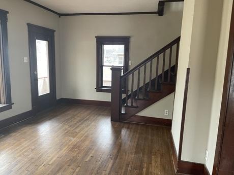 622 Clark St, Marseilles, IL 61341 - foyer featuring wood finished floors, healthy amount of natural light, ornamental molding, stairway, and baseboards